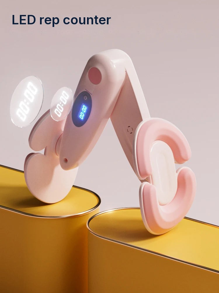 SŌLA Halo leg trainer in pink resting on a yellow block, showing the LED rep count display