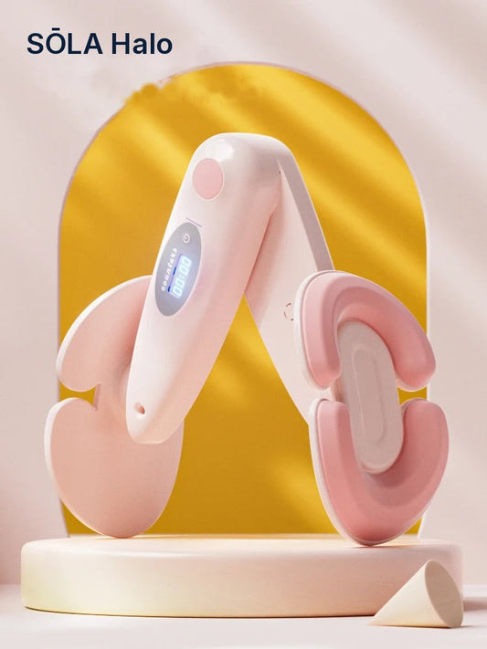 Pink SŌLA Halo leg trainer with curved padded arms in front of a yellow arch