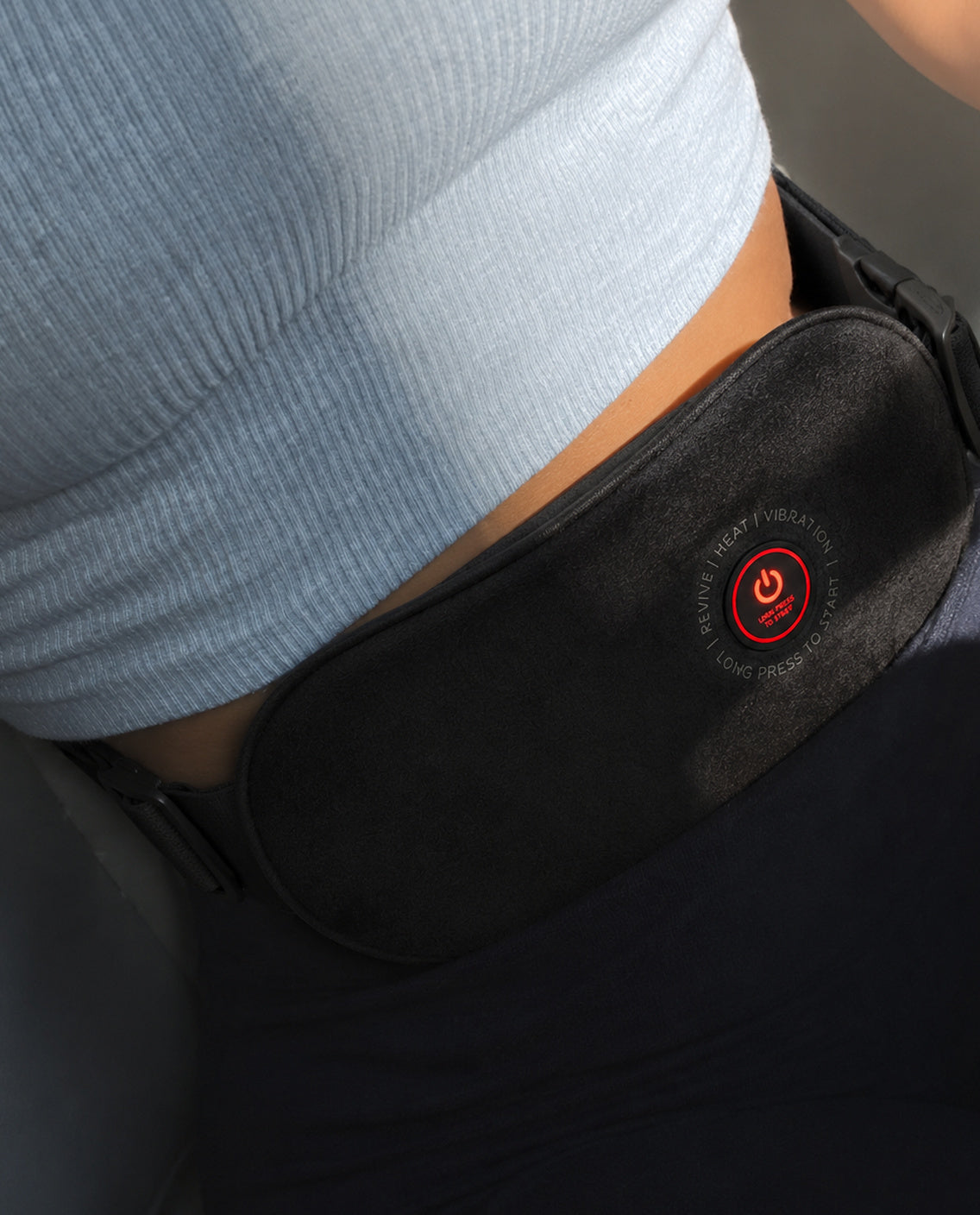 Close-up of the SŌLA heat wrap worn under a fitted top